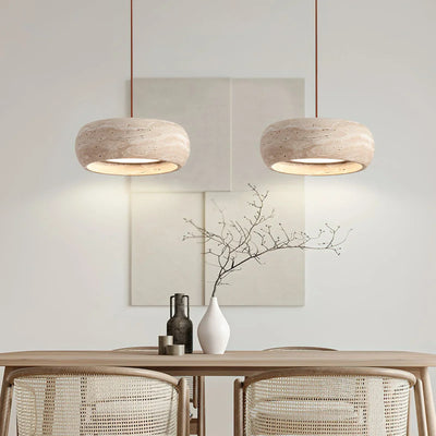 Travertine drum pendants over a dining table beside alabaster comparison