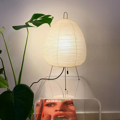 the-lamp-that-is-its-own-shade-paper-table-lamps-at-the-bedside