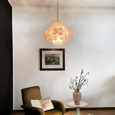 Pink murano glass disk chandelier in a vintage reading corner