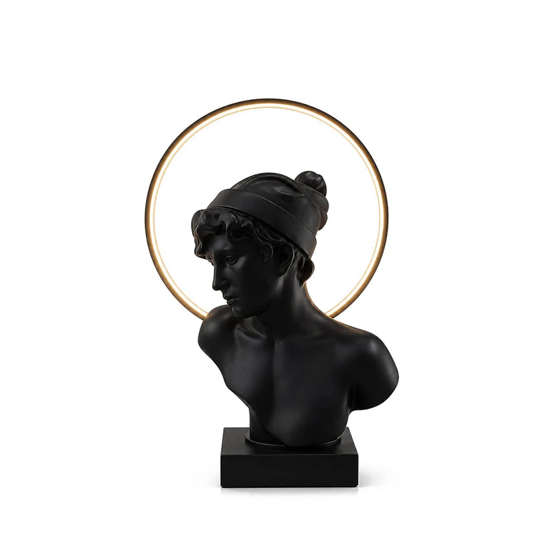 Aureola Sculptural Bust Table Lamp Korewolamp Master Hero Cutout View Fully Lit with Warm Glowing Halo Ring behind Matte Black Greek Statue on White